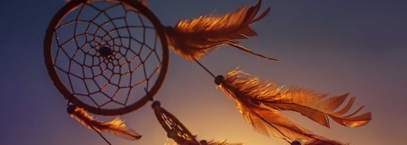 Photo of dream catcher blowing in the wind