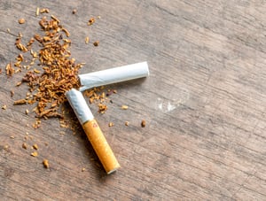 Broken Cigarette on a wood table.